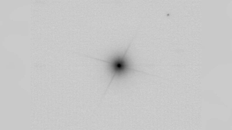 The triple system HIP96515: a low-mass eclipsing binary with a DB white   dwarf companion