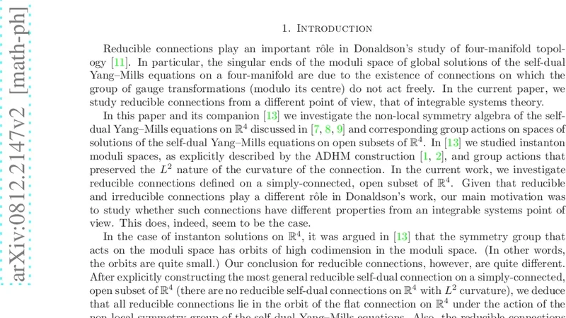 Reducible connections and non-local symmetries of the self-dual   Yang-Mills equations